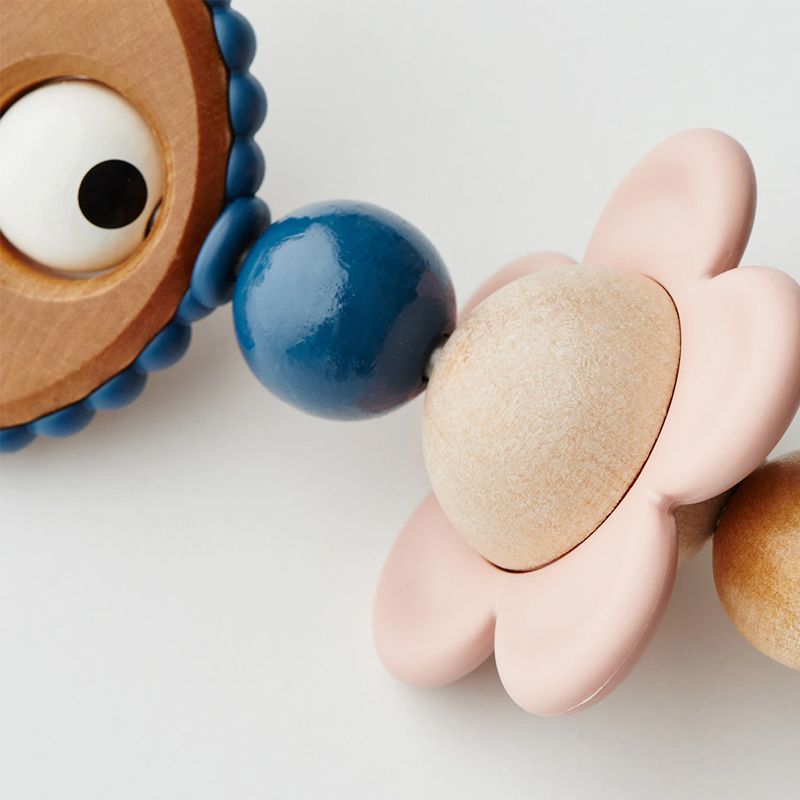 Juguete de Madera BabyBjörn para Hamaca Ojitos Traviesos Pastel - BABYBJÖRN